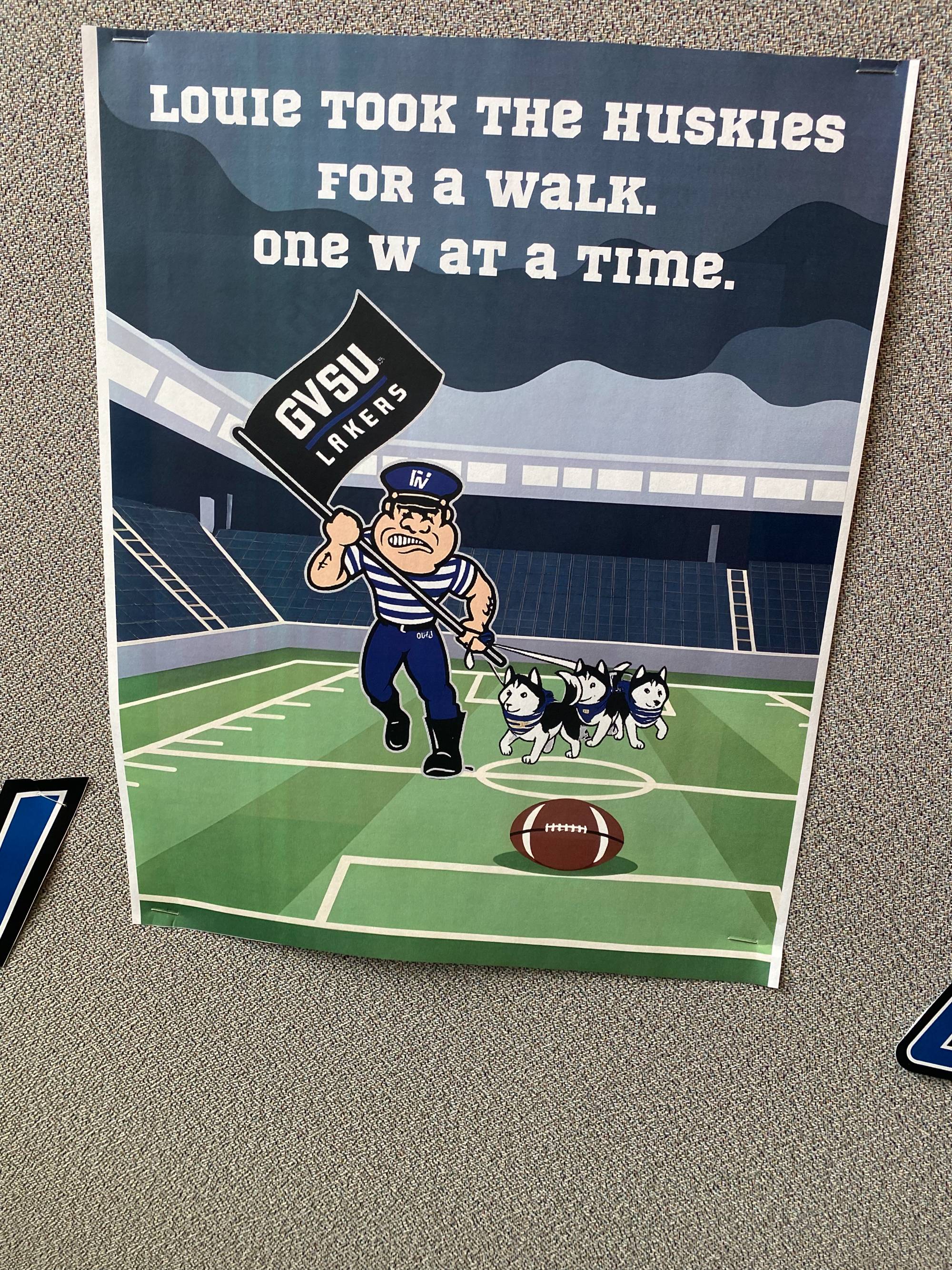 Facilities Planning Homecoming decorations, "Louie took the huskies for a walk" sign